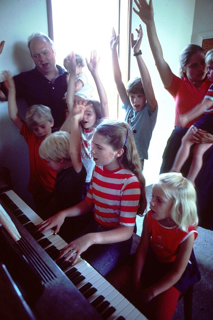 family around piano