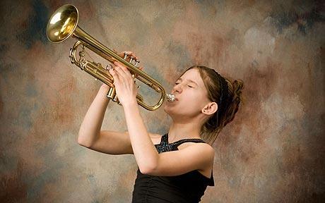 girl playing brass instrument