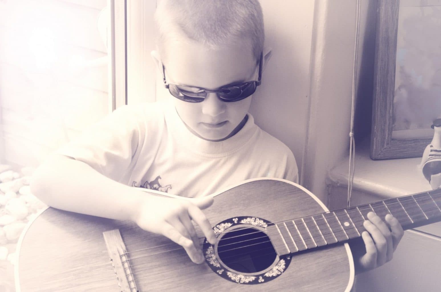 boy plays guitar