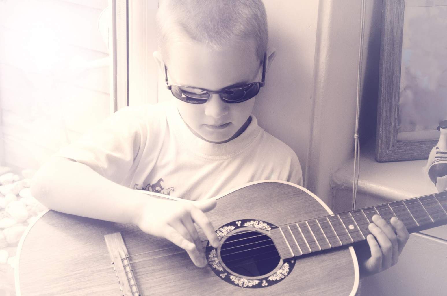 boy plays guitar