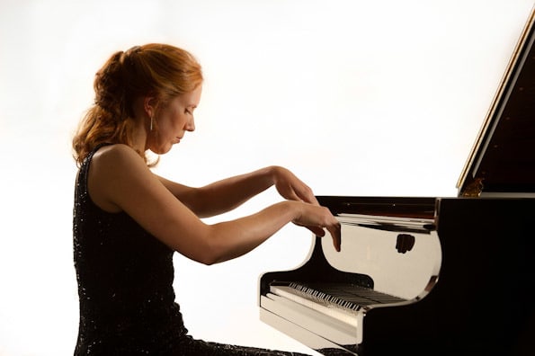 woman plays the piano