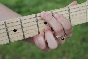 holding a chord