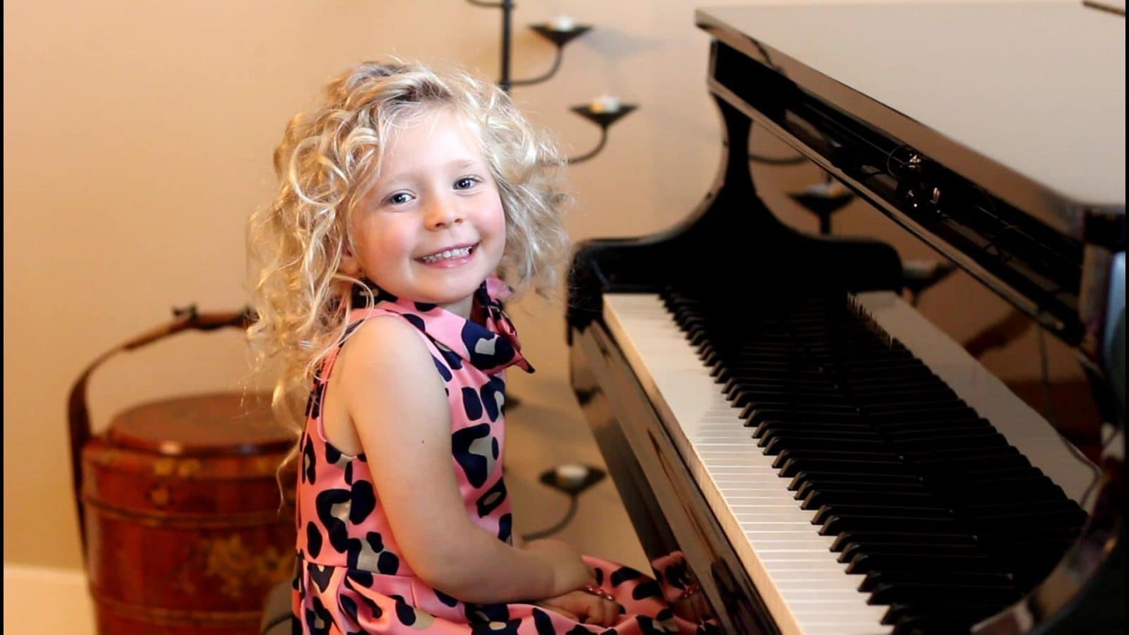 happy girl playing the piano