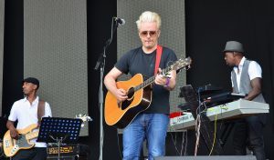 man playing acoustic guitar