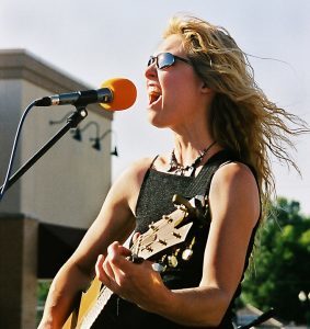 woman performing at an outdoor event