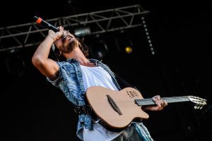 man plays the guitar and sings