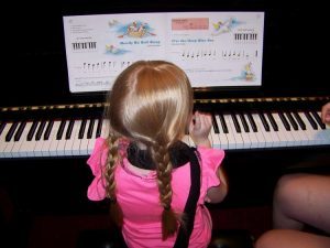 girl playing the piano