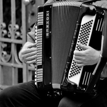 man playing playing the accordion