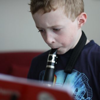 boy playing the clarinet