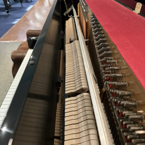 Interior picture showing hammers and strings on a used Bentley Upright Piano in ebony polish