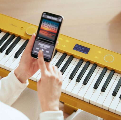 Woman using a smart phone with the Casio PX-S7000 in Harmonious Mustard
