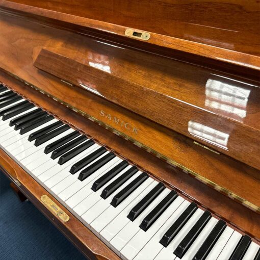 Used Samick SU131 Upright Piano in Polished Walnut Front Logo