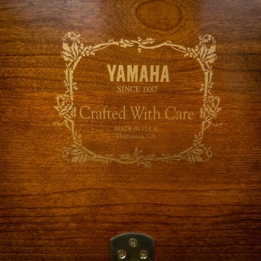 Used Yamaha M500H Upright Piano in Satin Cherry Logo Detail