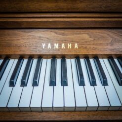 Used Yamaha Spinet Upright Piano in Satin Walnut Logo