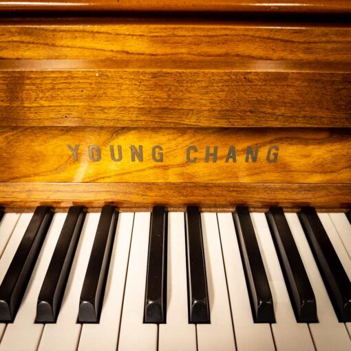 Used Young Chang F116 Upright Piano in Satin Cherry Logo