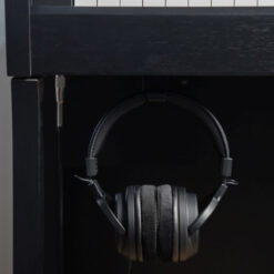 Image of Kawai SH-9 Headphones hanging underneath a Kawai CA401 digital piano