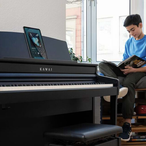 Image of Kawai CA401 Digital Piano, with boy in blue shirt in background.