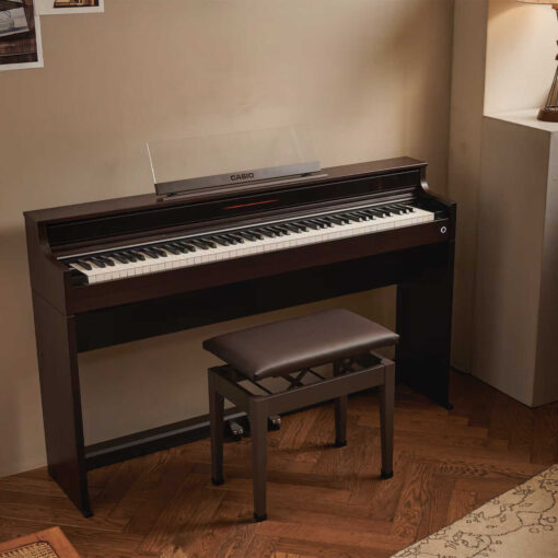 A Casio AP-S450 in brown on a hardwood floor