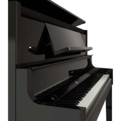 Side angle of a Roland LX-9 Digital piano with top lid and key cover open.